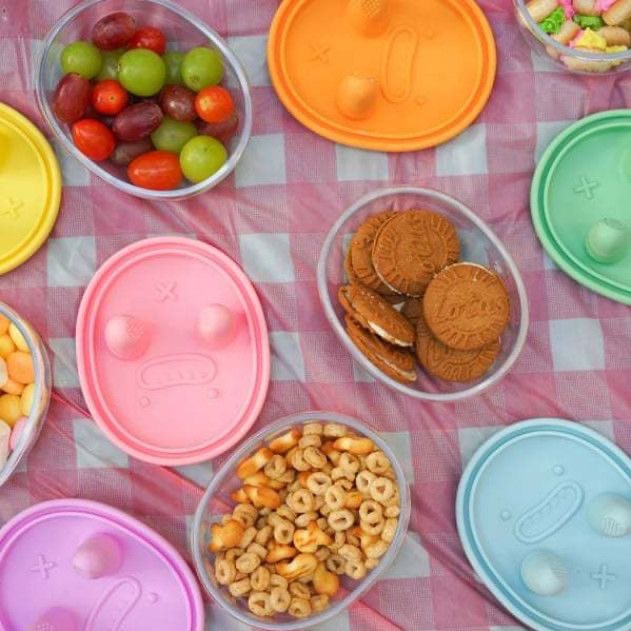 No-Mess Snack Container shown in multiple colours